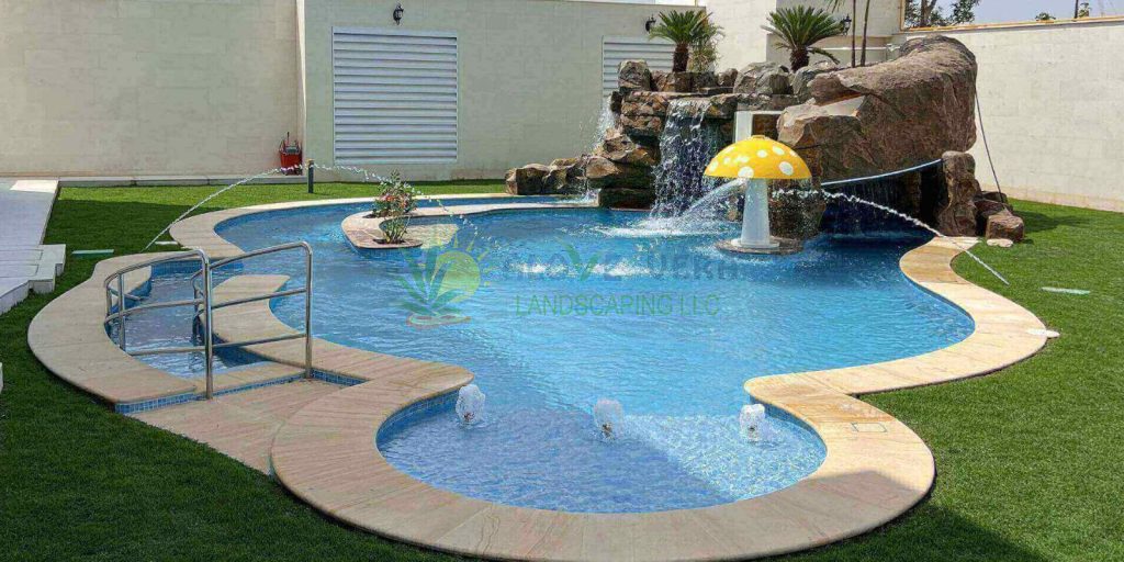 a well designed pool with water feature in dubai