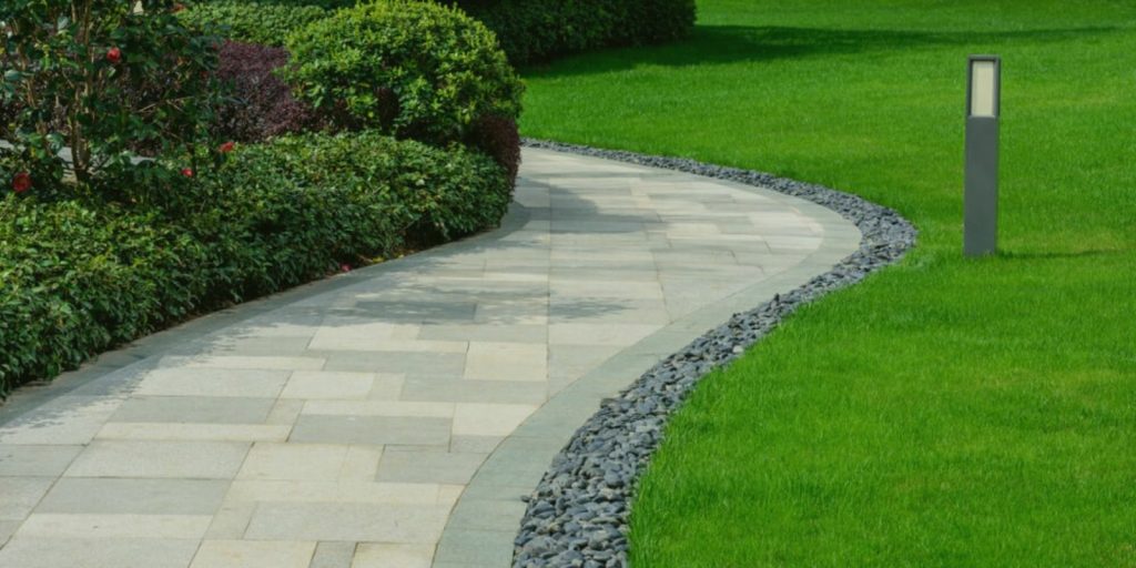 paved walkway in beautifully paved backyard