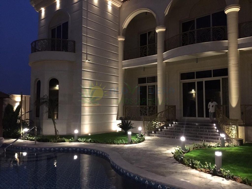 night view of a landscaped backyard