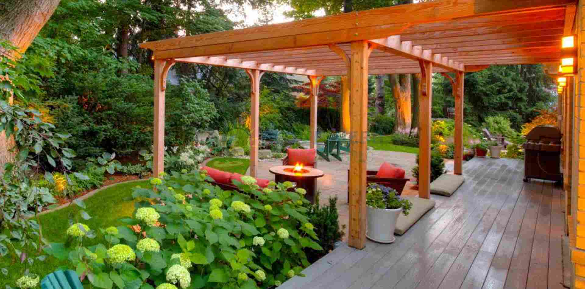 a wooden pergola surrounded with greenery