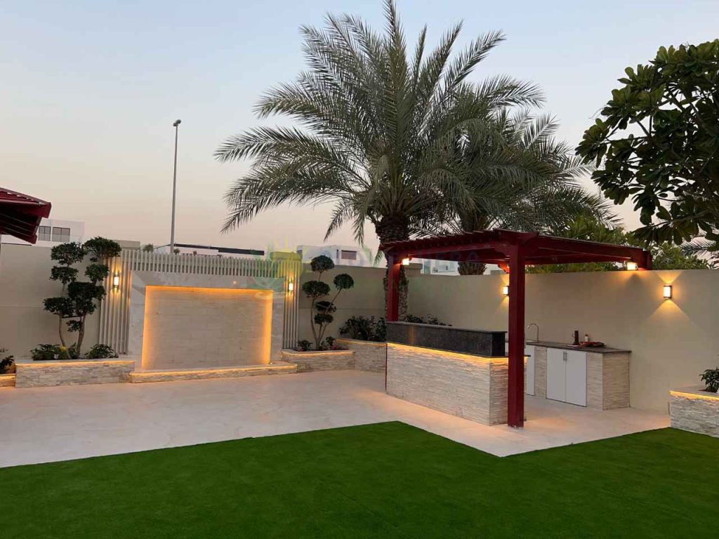 pergola with a well maintained water feature besides it