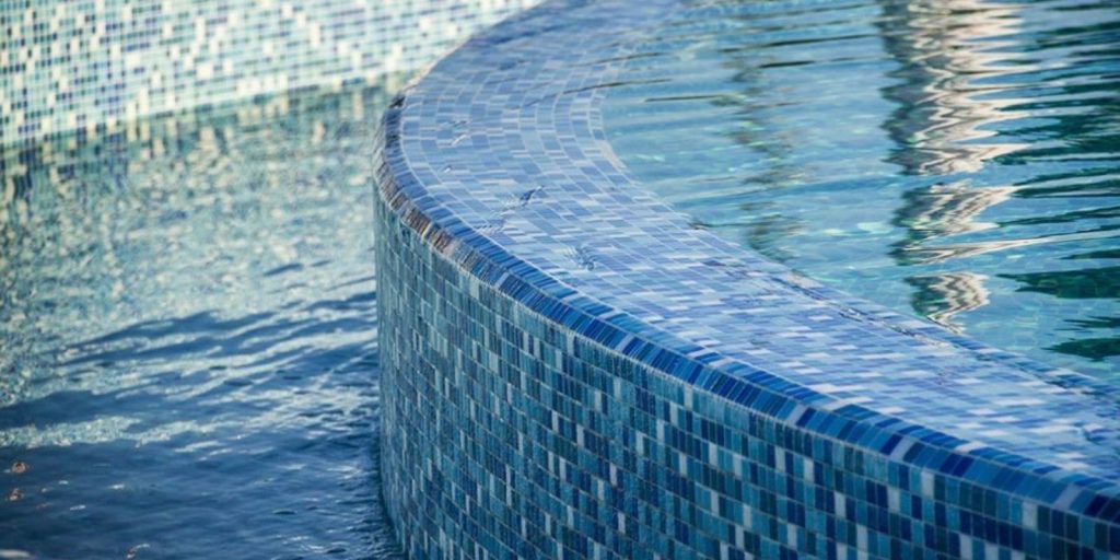 glass tiles paved in an outdoor swimming water feature