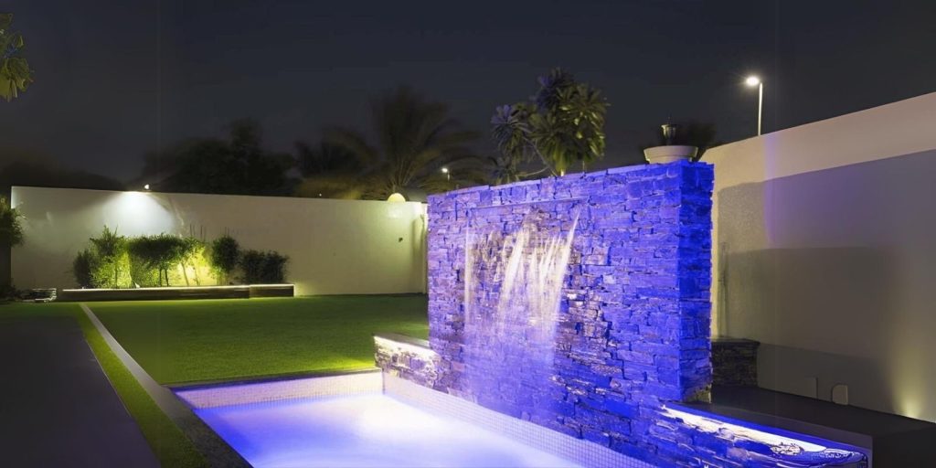 How to Set Up a Water Feature in UAE Gardens 2 An image of water feature in UAE with blue lights in night